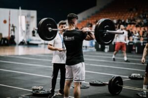 Athlete training on a sports field to improve athletic success, sports performance, and overall fitness through disciplined practice