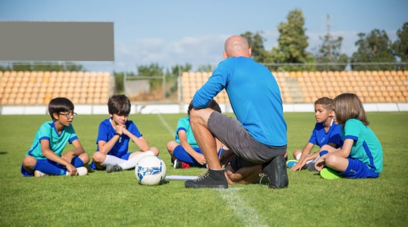 Young athlete training on a sports field while working toward a successful athletic career through discipline, fitness, and skill development