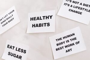 Infographic title card reading "10 simple daily habits that can transform your well being" with a serene morning background.