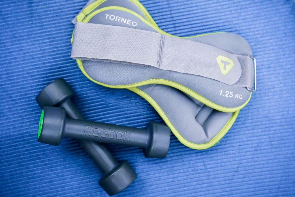 Use a combination of body measurements, workout performance, progress photos, clothing fit, and energy levels.