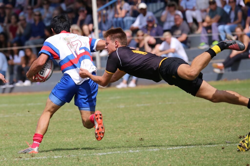 Athlete performing an Aussie Rules workout to build athletic fitness