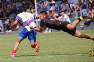 Athlete performing an Aussie Rules workout to build athletic fitness