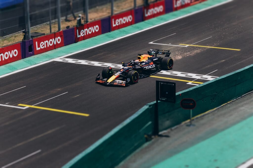 Formula 1 race cars speeding through the illuminated street circuit at the Saudi Arabian Grand Prix 