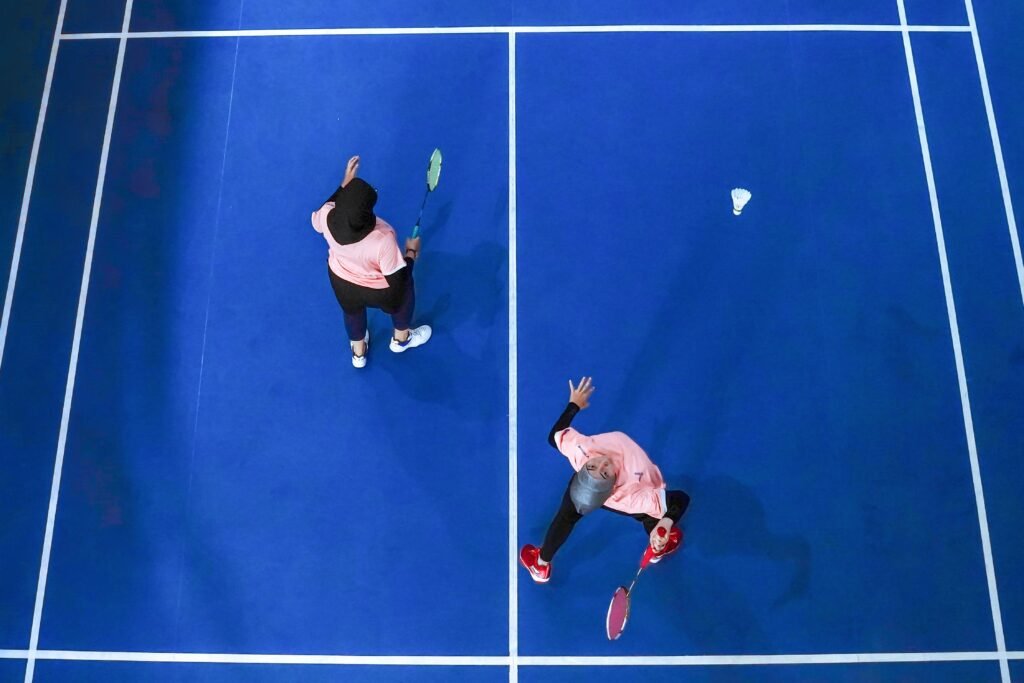 Malaysian badminton player competing in a match 