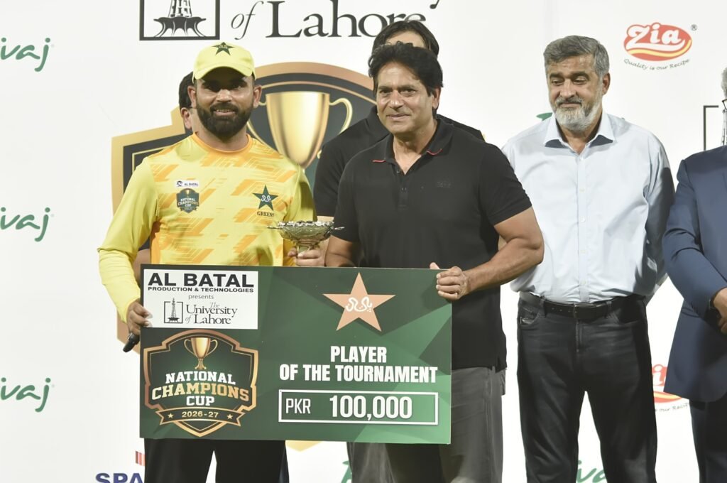 alt="Pakistan Gold team celebrating with the National Champions Cup 2026-27 trophy at Multan Cricket Stadium"