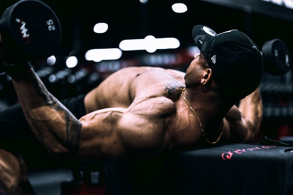 Person tracking rest interval timer during high-intensity weight training session