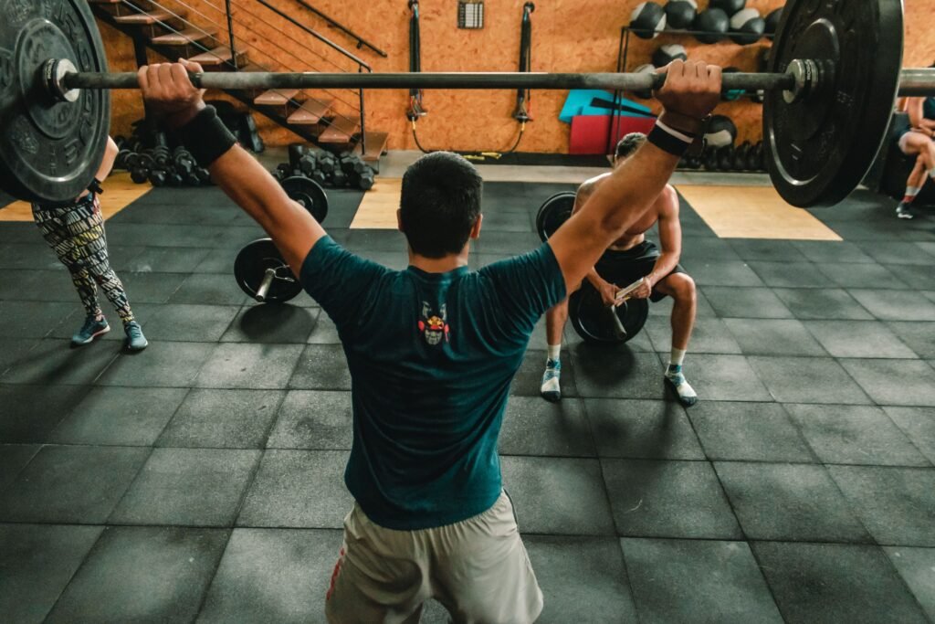 alt="Athlete performing high-intensity sprint intervals on an air bike to trigger EPOC afterburn" 