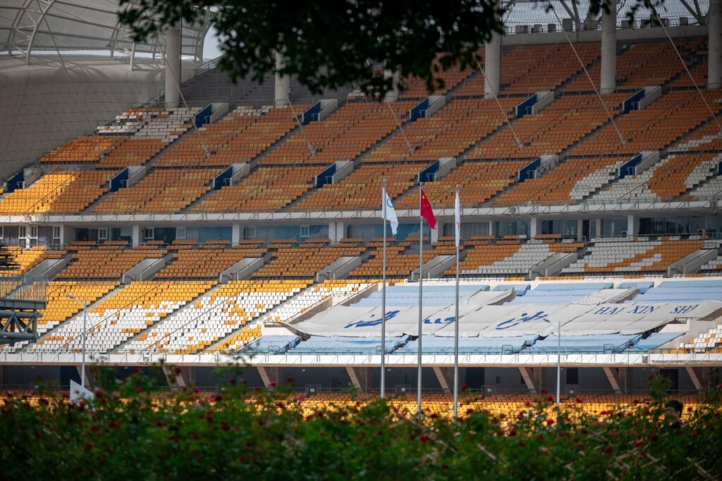 Track runners competing in a sprint race on the athletics track at Paloma Mizuho Stadium 