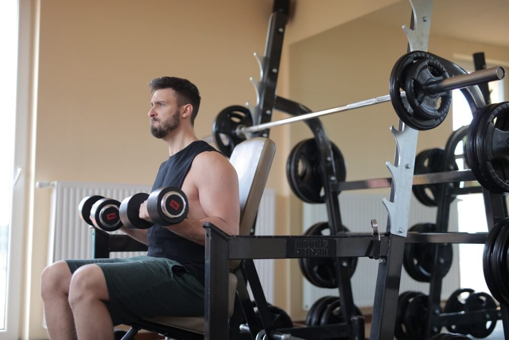 Fitness athlete performing high-intensity interval training on an Airdyne bike to maximize calorie burn. 