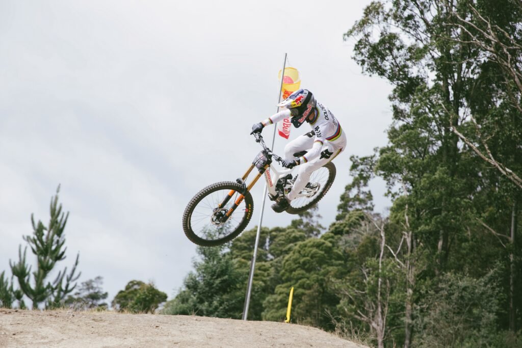 UCI Mountain Bike World Championships Head to Val di Sole Downhill rider navigating the technical Black Snake track in Val di Sole.