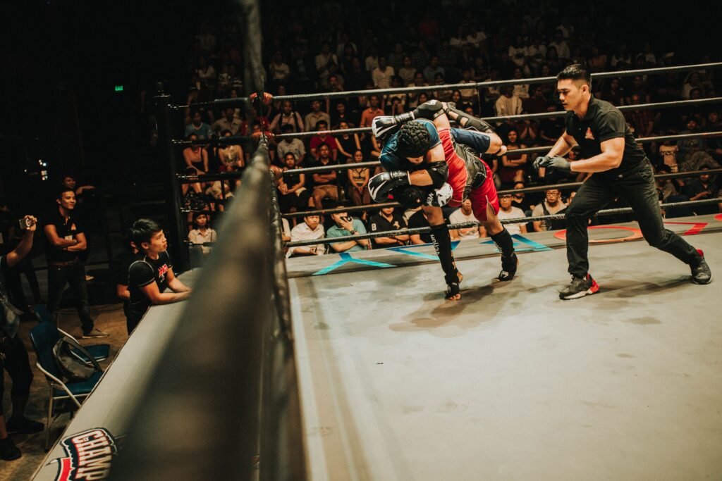 Professional mixed martial arts fighters competing inside the octagon during a championship match in Abu Dhabi 