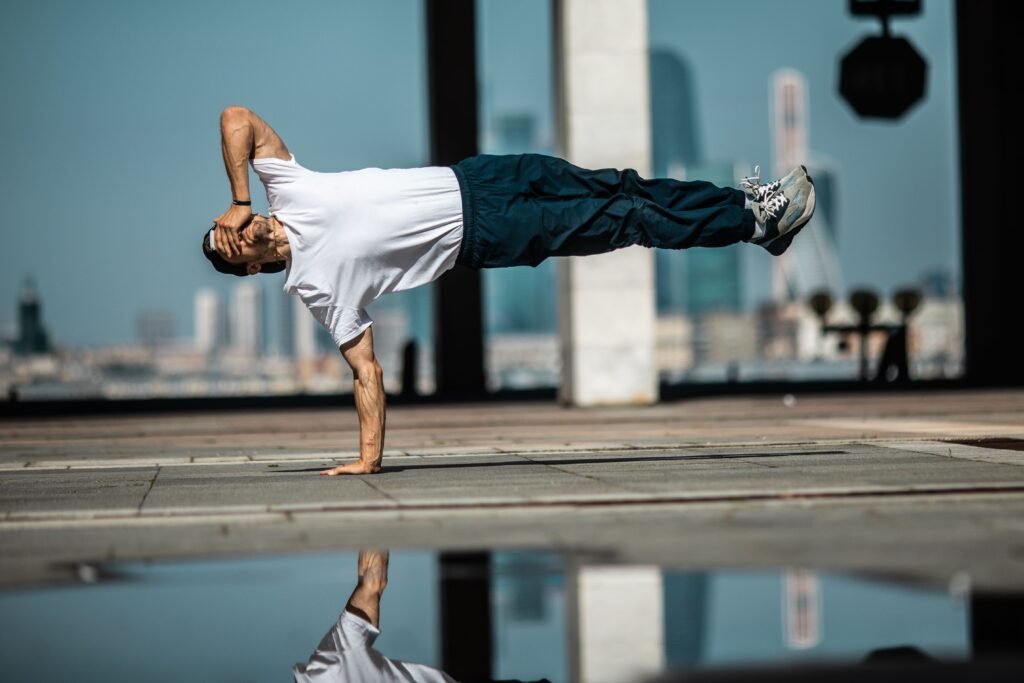 An athlete performing short exercise snacking mobility routines in an office setting.