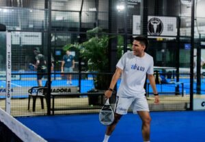 Players enjoying a padel match on a modern court in London.