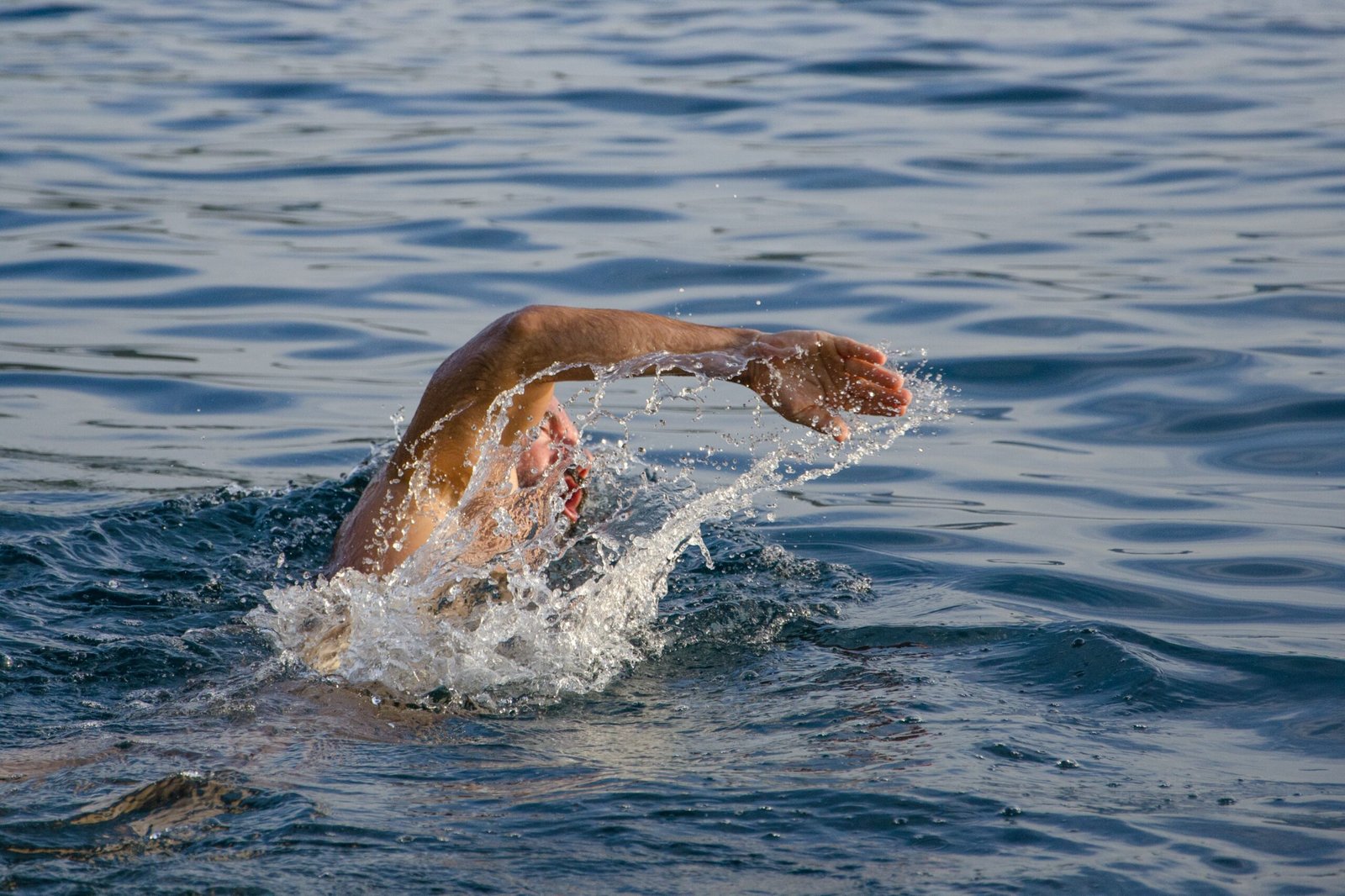 An athlete using a cold plunge tub after an intense workout.