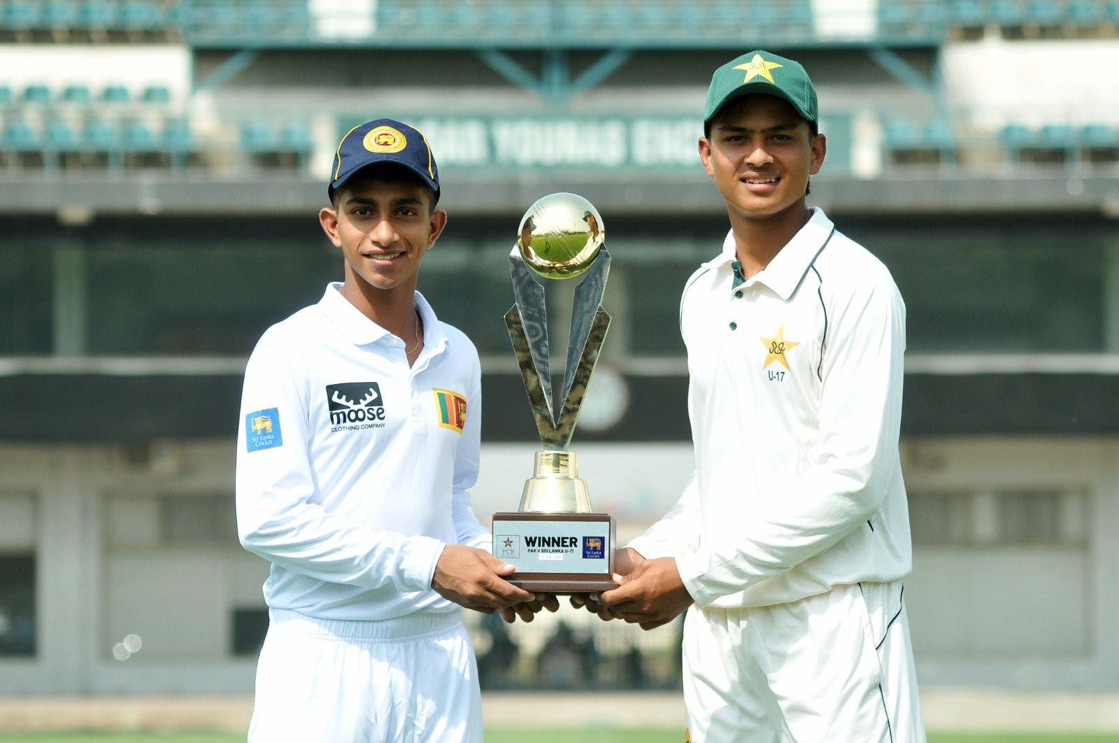 Pakistan U17 and Sri Lanka U17 captains unveil the trophy at Multan Cricket Stadium